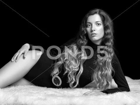 Beautiful girl on furs Stock Photos