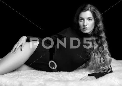 Beautiful girl on furs Stock Photos