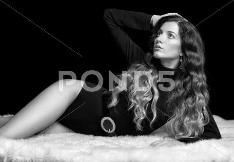 Beautiful girl on furs Stock Photos