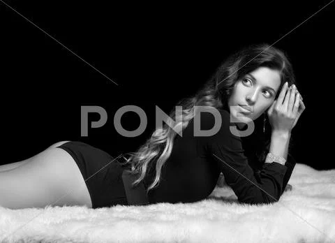 Beautiful girl on furs Stock Photos
