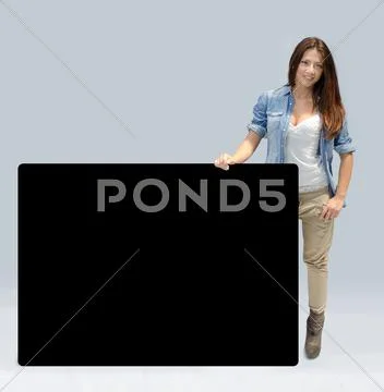 Beautiful girl holding large black board Stock Photos
