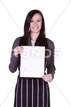 Beautiful girl in the kitchen holding a blank sign Stock Photos