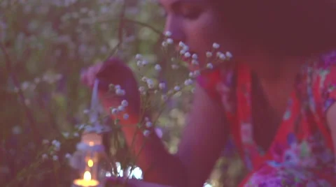 Beautiful girl with lantern finding magic lights in grass at night. Stock Footage 67357968