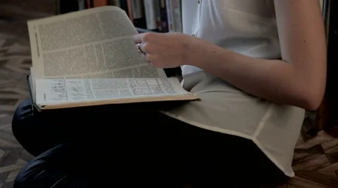 Beautiful girl in the library Stock Footage 61752653