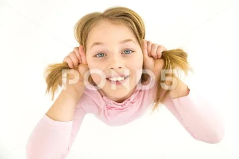 The beautiful girl look to the camera. View from above Stock Photos