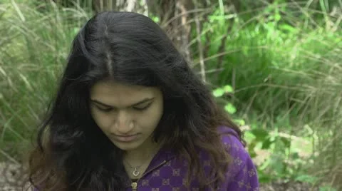 Beautiful girl looking down Stock Footage 12721979