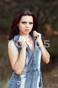 Beautiful girl on a pine-wood Stock Photos