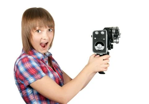 Beautiful girl in plaid shirt with movie camera Stock Photos