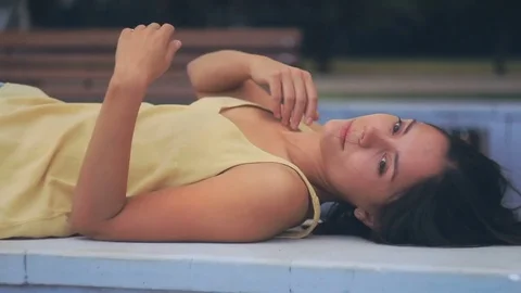Beautiful girl posing in front of camera and stretches Stock Footage 69821779