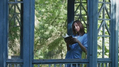 Beautiful girl reading book Stock Footage
