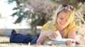 Beautiful Girl Reading in Park 4955 HD Footage