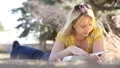 Beautiful Girl Reading in Park 4955 HD Footage