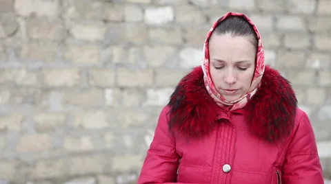 Beautiful girl in a red winter jacket talking on the phone Stock Footage 59029068