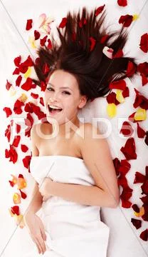 Beautiful girl in rose petal. isolated. Stock Photos