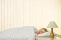 The beautiful girl sleeping on the bed Photo