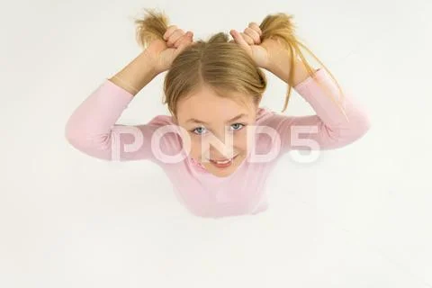 The beautiful girl smile to the camera. View from above Stock Photos