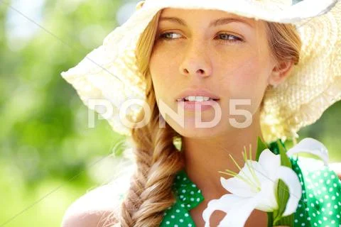 A beautiful girl in summer hat Stock Photos