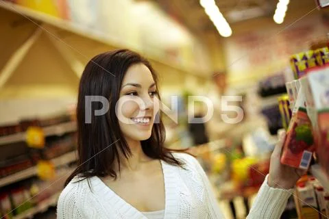 Beautiful girl at supermarket Stock Photos