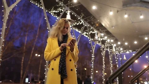 Beautiful Girl Talking on the Phone on the Night City, Illumination Stock Footage