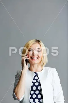Beautiful girl talking on phone Stock Photos