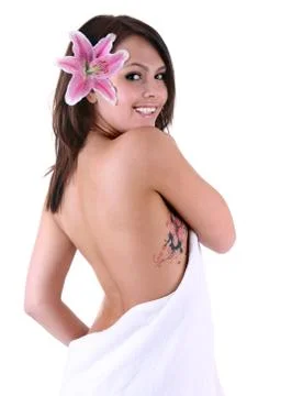 Beautiful girl with tattoo and flower. Stock Photos