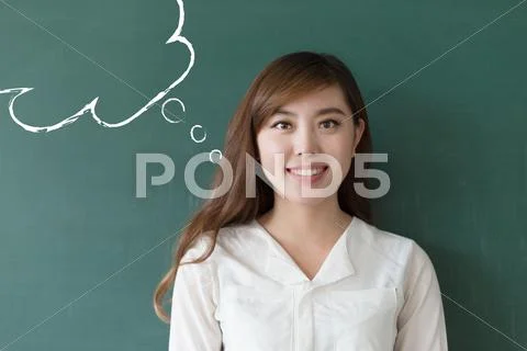 Beautiful girl teacher with green blackboard Stock Photos