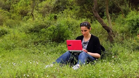 Beautiful girl using computer in countryside 2 Stock Footage 5503021