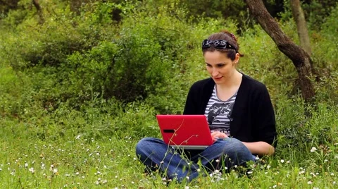 Beautiful girl using computer in countryside 3 Stock Footage 5503052