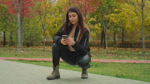 Beautiful Girl Using Smartphone Posing For Selfie Red Helium 8K Stock-Footage 142641415