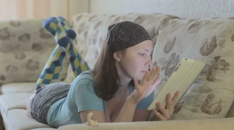 Beautiful girl using a tablet Stock Footage 68764148