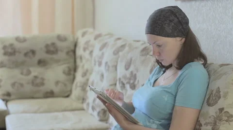 Beautiful girl using a tablet Stock Footage 68764239