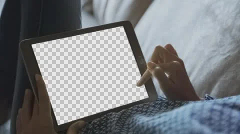 Beautiful girl using tablet pc with Isolated screen laying on sofa at home 2. Stock Footage 65251875