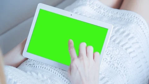 Beautiful Girl Using Tablet PC with Green Screen Laying on Sofa at Home 26 Stock Footage 73756846