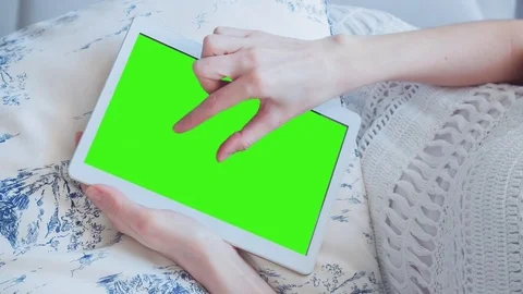 Beautiful Girl Using Tablet PC with Green Screen Laying on Sofa at Home 28 Stock Footage 73813623