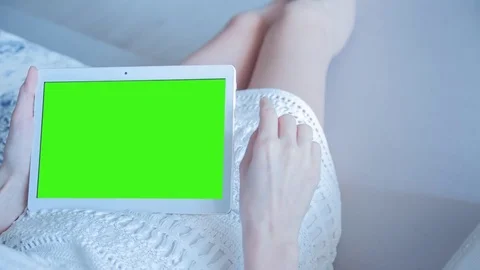 Beautiful Girl Using Tablet PC with Green Screen Laying on Sofa at Home 29 Stock Footage 73815088