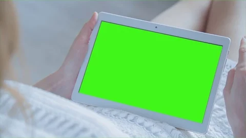 Beautiful Girl Using Tablet PC with Green Screen Laying on Sofa at Home 36 Stock Footage 74492027