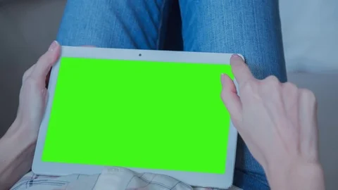 Beautiful Girl Using Tablet PC with Green Screen Laying on Sofa at Home 43 Stock Footage 74906664
