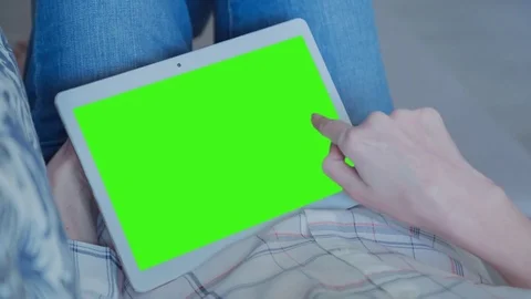 Beautiful Girl Using Tablet PC with Green Screen Laying on Sofa at Home 46 Stock Footage 74981036