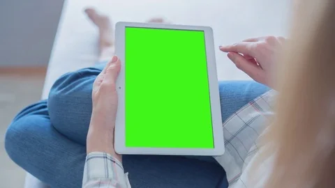 Beautiful Girl Using Tablet PC with Green Screen Laying on Sofa at Home 47 Stock Footage 75206585