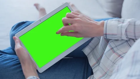 Beautiful Girl Using Tablet PC with Green Screen Laying on Sofa at Home 48 Stock Footage 75207510