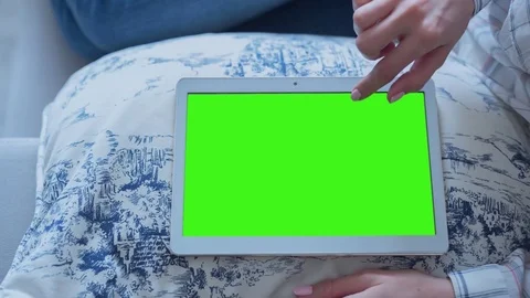 Beautiful Girl Using Tablet PC with Green Screen Laying on Sofa at Home 72 Stock Footage 75435271