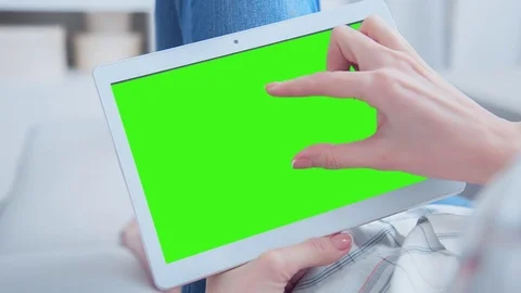 Beautiful Girl Using Tablet PC with Green Screen Laying on Sofa at Home 79 Stock Footage 79506499