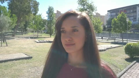 Beautiful Girl Walking in the Park on a Sunny Day Stock Footage
