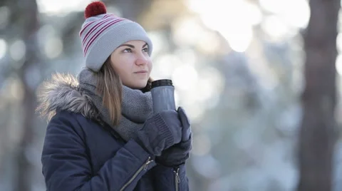 Beautiful girl walks on a snow-covered forest in a day Stock Footage 59658300