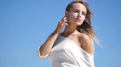 Beautiful girl in a white dress outdoors Stock Footage