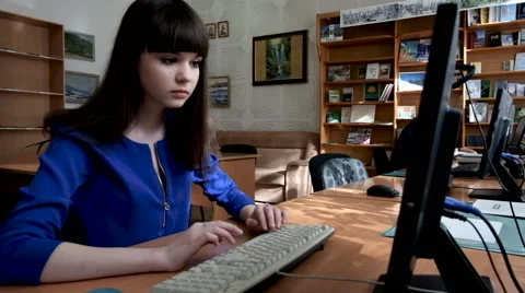 Beautiful girl works at the computer Stock Footage 61753688