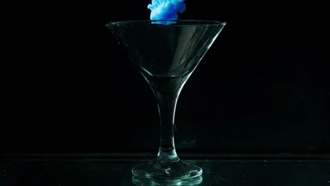 Beautiful glass goblet envelops thick blue smoke Stock Footage 88637597
