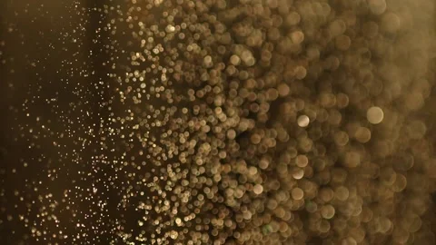 Beautiful glitter of floating dust particles on a dark background in slow motion Stock-Footage 199516495
