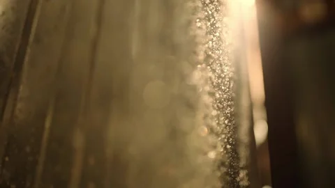 Beautiful glitter of floating dust particles on a dark background in slow motion Video stock 202353211