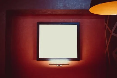 Beautiful glowing frame on red wall with free space. The concept of modern de Stock Photos